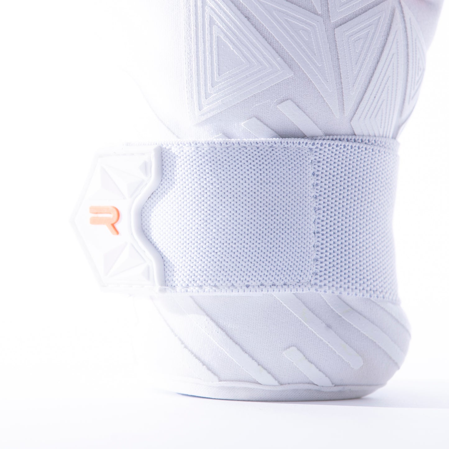 White and neon orange goalkeeper glove