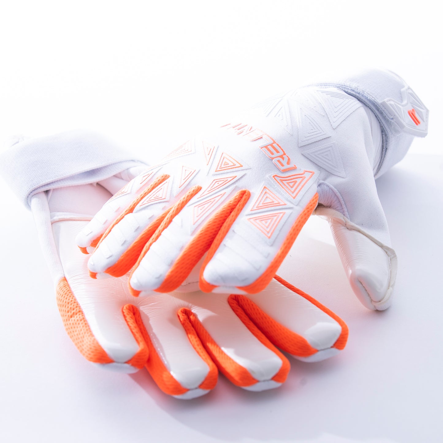 White and neon orange goalkeeper glove