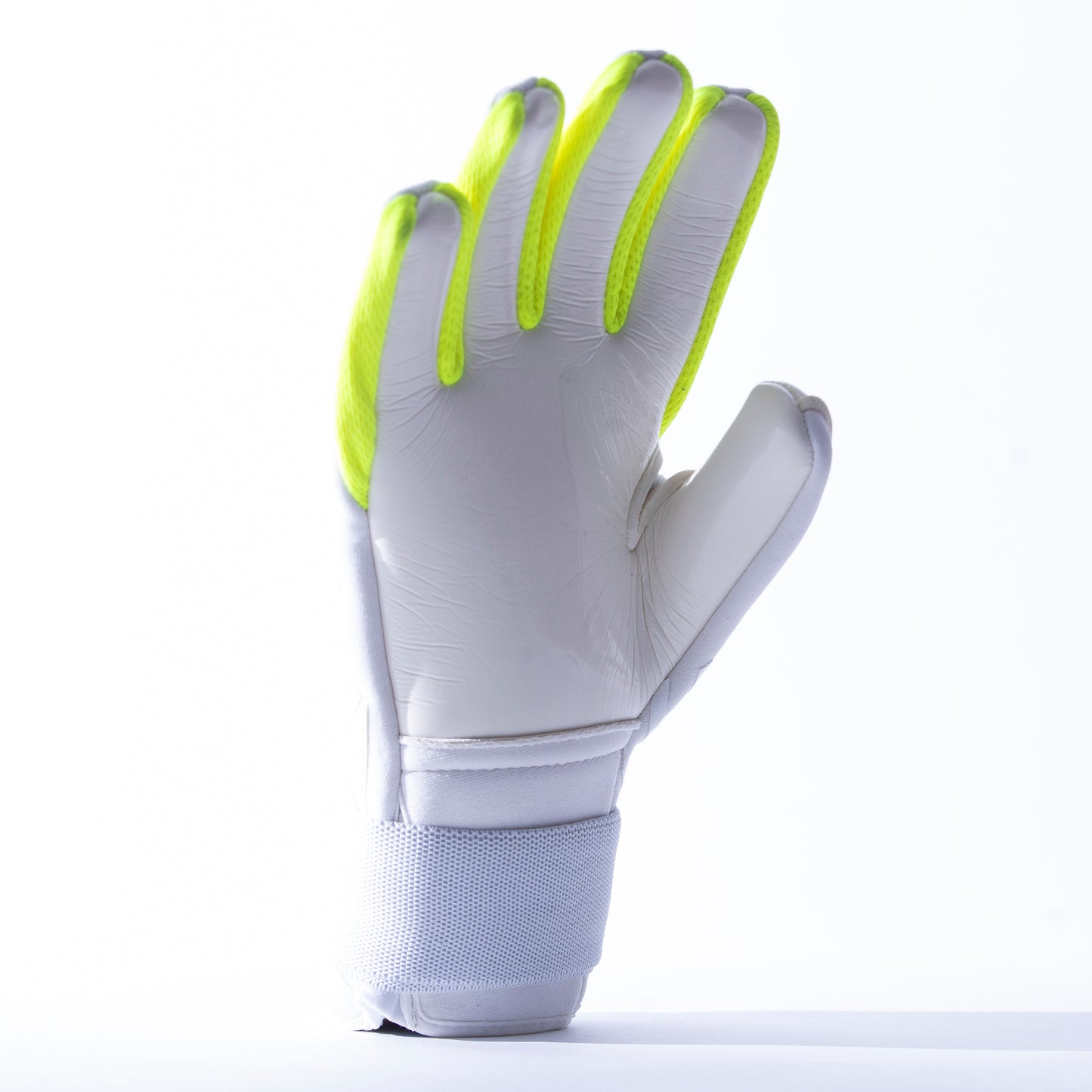 White and neon yellow goalkeeper glove